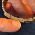 Metal_watch_band_fine_adjustment_holes_on_clasp 