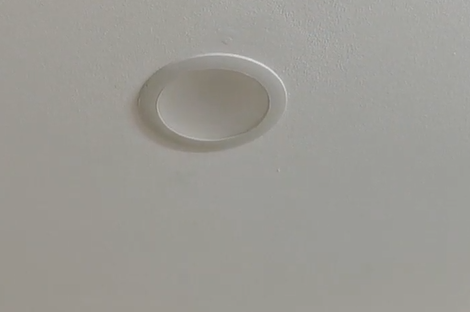 Install an LED downlight and enlarge hole in the ceiling with a clever jig to keep the hole saw centralised